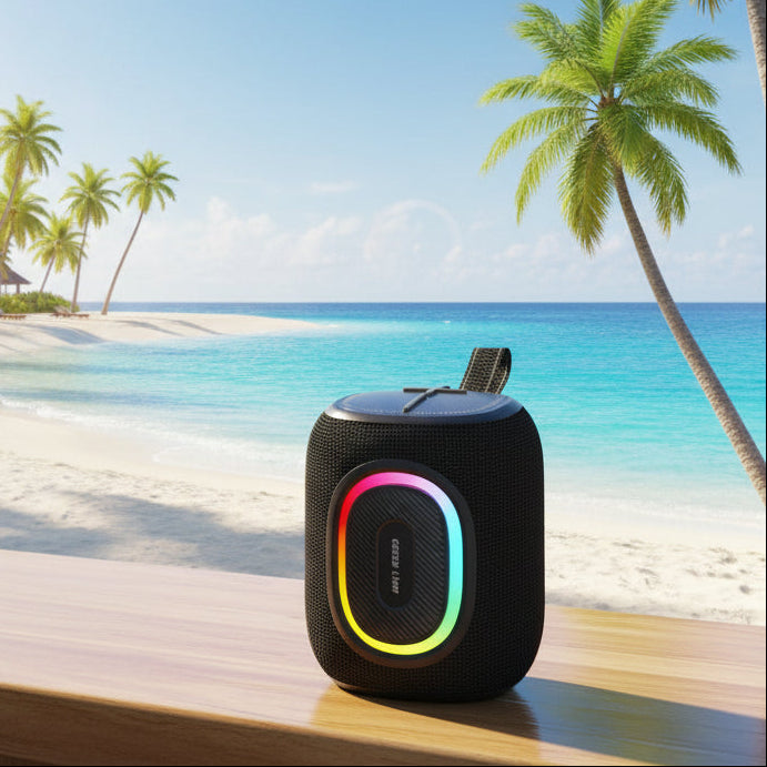 Black portable speaker with colorful LED ring on a white background